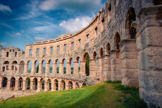 Dramatic summer view of popular touris destination - Pula Arena, Huge Roman amphitheater with an underground exhibition about ancient olive oil and wine production, Croatia, Europe.