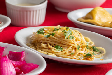 table with platter of Spaghetti Aglio e Olio