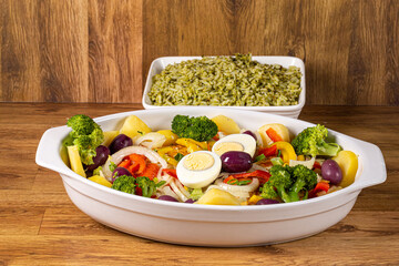 Cod - Fish Fillet with Sauce and Vegetables..A typical Portuguese dish with cod called Bacalhau a Portuguesa served with broccoli rice.selective focus