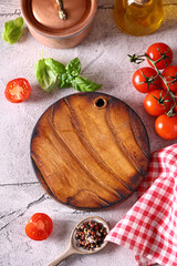 food background with wooden board tomatoes and basil