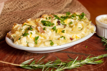 Carbonara pasta with pancetta, egg, hard parmesan cheese and cream sauce.
