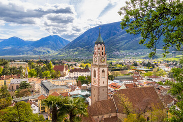 Fototapeta na wymiar View over cityscape with Cathedral Saint Nikolaus of Merano, South tyrol, Italy seen from famous hiking trail Tappeinerweg