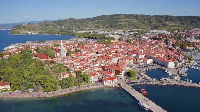 4k drone flight moving to the side footage (Ultra High Definition) of Izola town, Slovenia. Superb morning seascape of Adriatic sea. Сharm of the ancient cities of Europe.