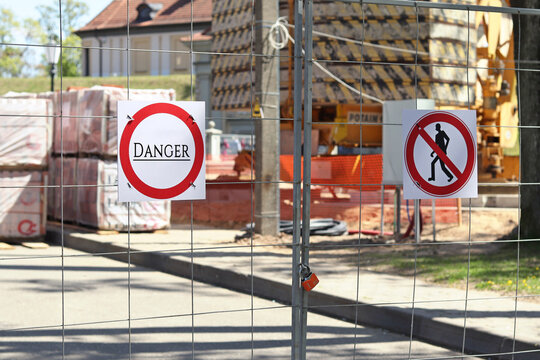Fencing with a sign "Danger", industrial area