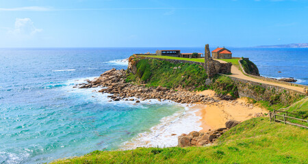 tourism in Galicia- Spain panoramic view of atlantic ocean and Ermita da Nosa Senora da Lanzada, ...