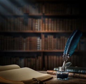 Old quill pen with an inkwell, papers and books on a table against an old bookshelf. Concept on the theme of history, education, literature. Retro style.