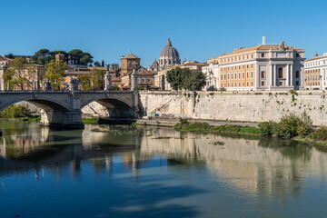 Fototapeta na wymiar Beautiful cityscape of Rome in a sunny day, with the Tiber River and the famous St. Peter Basilica, Italy