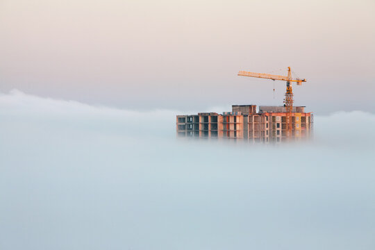 bulding under construction covered by mornig fog