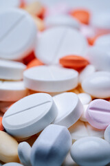 Medicine and drug concept. Close up shot of white and colored pills  of different kinds.