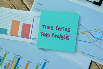 Concept of Time Series Data Analysis write on sticky notes isolated on Wooden Table.
