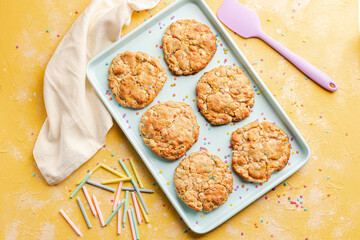 Homemade funfetti cookies on a plate with party candles