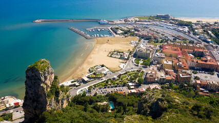Obraz premium Aerial view of the port of Terracina, near Rome, in the Province of Latina, Italy. There are many boats moored at the marina. In foreground the Levante beach.