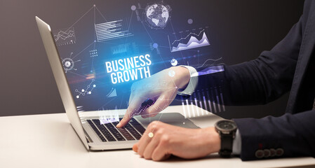 Businessman working on laptop, business concept