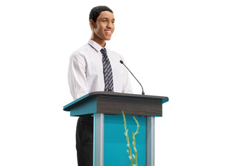 Young african american man standing behind a podium and smiling