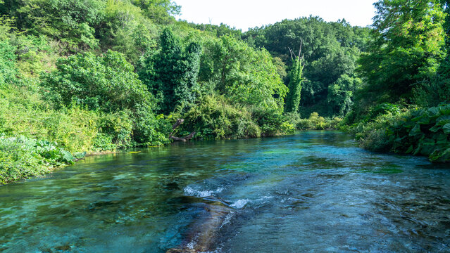 Unique karst source of water gushing from the ground called the Blue Eye or Syri i Kalter. Albania.