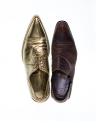 concept of rich and poor in a shoes, old and golden shoe