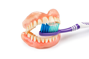 Dentures with toothbrush