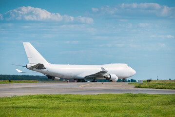 Big plane at runway on sunny day