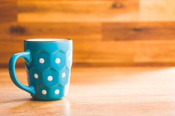 Fototapeta na wymiar The polka dot mugs on kitchen table.