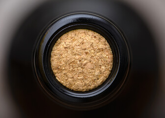 Close-up view of oak cork inside sealed bottle of wine
