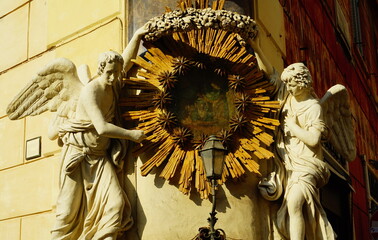 Sculpture with angels on the palace near the Trevi fountain