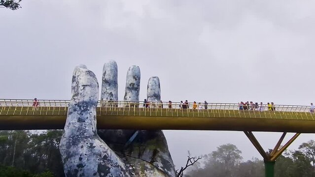 Golden Bridge Marvel: Giant Hands Embrace the Spectacular Ba Na Hills Amusement Park 1