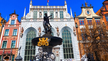 Neptune's fountain in Gdansk in front of historic houses. Poland April 30, 2022 © Виктория Марьенко
