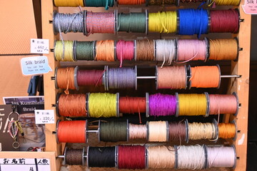 Japan sightseeing trip. Traditional craft 'Iga braided cord'. Iga City, Mie Prefecture. Woven from silk thread and used for Japanese clothing. In the past, it was used for armor and swords.