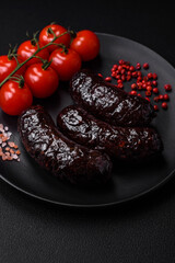 Delicious black blood sausage or black pudding with spices and herbs