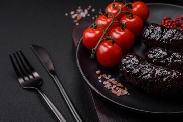Delicious black blood sausage or black pudding with spices and herbs