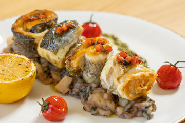Fried fish served with boiled vegetables
