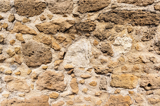 Antique stone yellow wall. Texture background