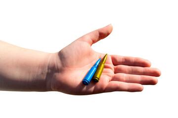 Two yellow-blue cartridges in a hand on a transparent background. The concept of military support for Ukraine