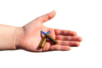 Two yellow-blue rifle cartridges with the inscription STAND WITH UKRAINE in hand on a transparent background. The concept of military support for Ukraine