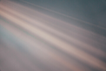 Natural light flares on white wall texture background. White stucco wall surface background with diagonal light beam and shadows lines and silhouettes for backgrounds, overlay effect