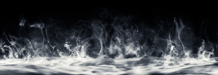 Real smoke swirling upwards. Dramatic smoke or fog effect for spooky Halloween or other dramatic background.