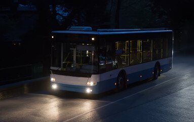 Fototapeta premium bus moves on a night road
