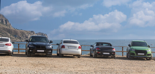 Fototapeta na wymiar Cars off the coast near the cape