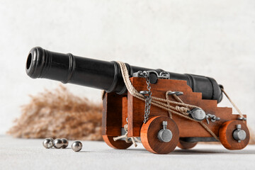 Toy model of cannon on light background