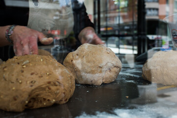 Unrecognizable woman preparing bread with seeds
