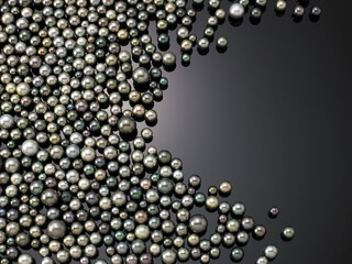 loose tahitian pearls on a black background