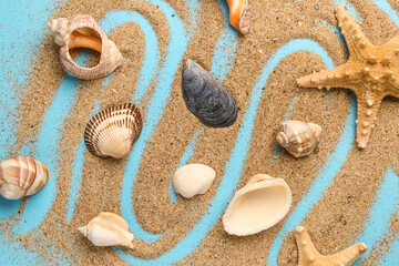 Fototapeta na wymiar Sand with starfish and shells on blue background
