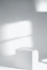 Minimal product display, white cube on white  background and window light. Podium pedestal scene, ...