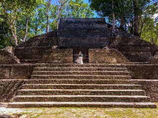 Tourist exploring Cahal Pech Mayan Ruin, San Ignacio, Belize
