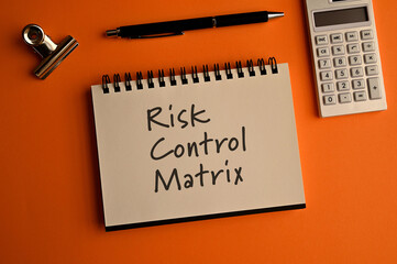 There is notebook with the word Risk Control Matrix.It is as an eye-catching image.