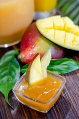 Fresh sauce, mango fruit dressing in a glass dish on the table close-up.