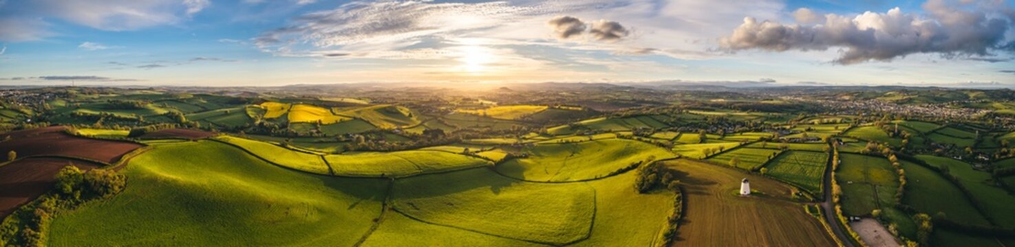 Sunset over Fields and Farmlands in spring from a drone, Devon, England,  Europe
