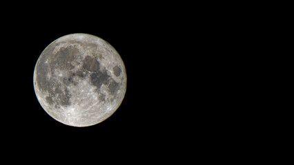 Detailed zoom photo of moon on black sky background. 16:9 