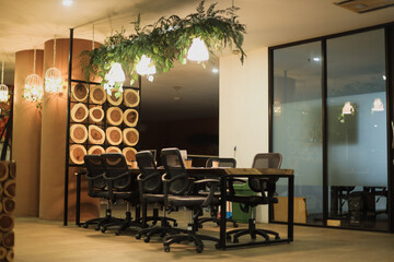 Creative work space in warm light, meeting room at modern office. 