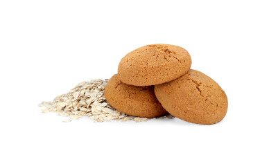 Delicious oatmeal cookies and flakes on white background